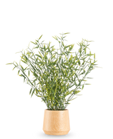 La Plante Artificielle Bambou 43 cm présente des feuilles de bambou aux feuilles vertes et des tiges fines dans un pot en bois clair, sur un fond blanc uni.
