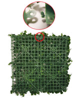Quatre panneaux en plastique vert ignifuge de 100 x 100 cm avec des feuilles artificielles Savanne sont reliés entre eux, illustrés avec un gros plan du mécanisme de verrouillage avec lequel les panneaux sont fixés les uns aux autres.
