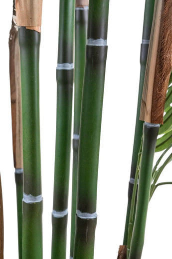 Gros plan du salon de plantes artificielles 180 cm, avec plusieurs tiges de bambou vert avec nœuds et segments visibles sur fond blanc. Certaines tiges ont des gaines partielles et quelques feuilles.
