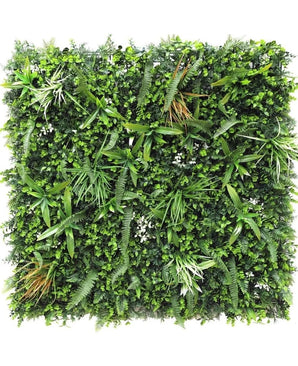 La Haie Artificielle Savanne ignifuge 100x100 cm est un panneau carré au feuillage vert artificiel dense et ignifuge avec des feuilles de plantes mélangées telles que des fougères et des graminées pour un effet de jardin vertical luxuriant.